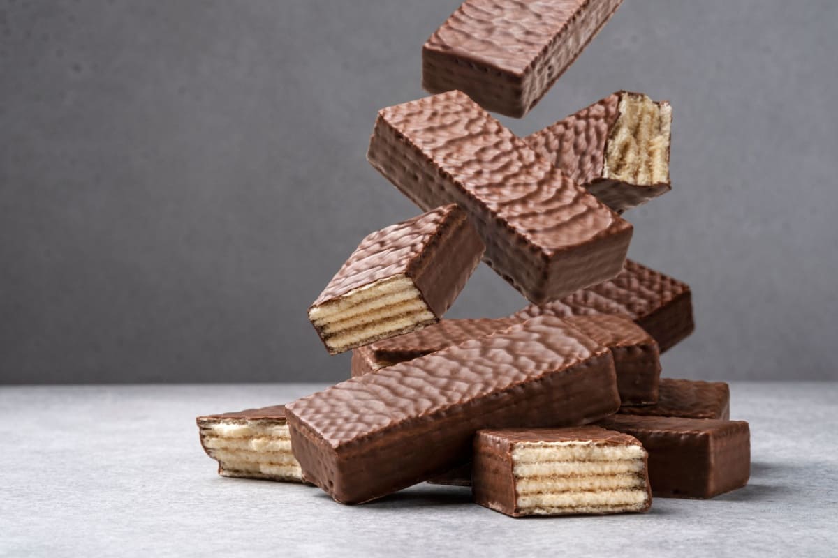 chocolate-wafers-falling-on-grey-floor-close-up-image